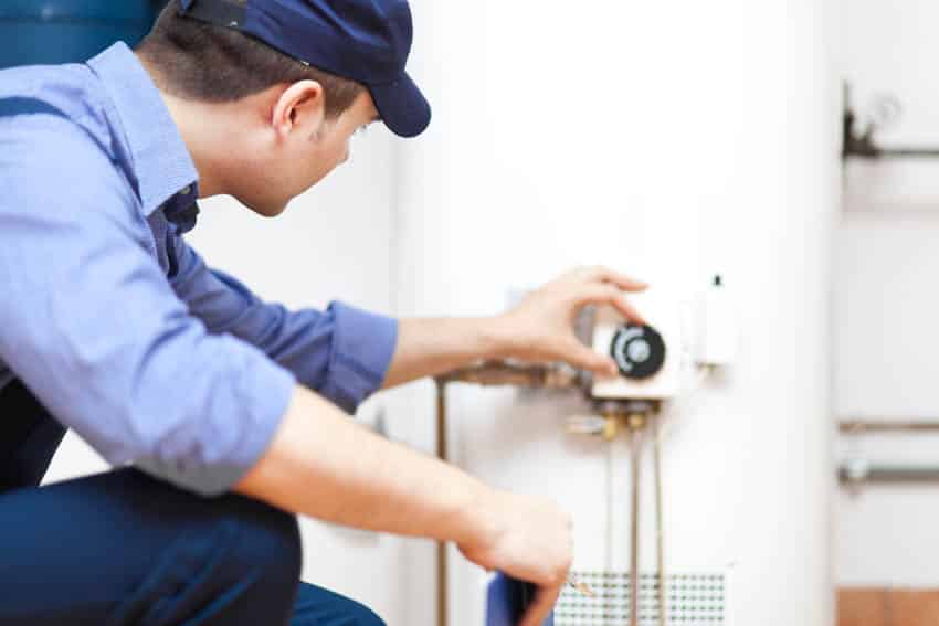 professional-plumber-fixing-water-softener-is